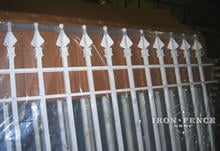 A custom white powder coated 6ft iron fence panel in our warehouse prior to shipment (Based on Style #1 - Classic)