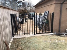 Stronghold Iron Fence and Gate Mounted on a Concrete Pad with Flange Posts