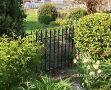 Wrought Iron Fence Panels used in a Garden Setting (3ft Tall Classic Style)