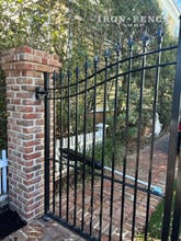 Wrought Iron Driveway Gate Attached to Brick Column with Custom Hinges