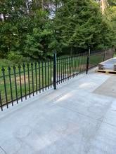 Stronghold Iron 3ft Tall Classic Fence Core-drilled into a Concrete Patio