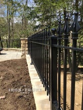 Wall Top Installation of an Iron Fence in Classic Style